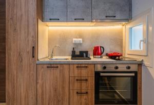 a kitchen with a sink and a counter top at Ark Urban Living in Kozani +15 photos