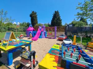 a childrens playground with a colorful play equipment at Garden Apartments in Ulcinj