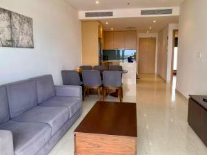 a living room with a couch and a table at 2BR Family Apartment Spectacular Scenery in Da Nang