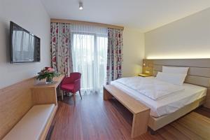Postel nebo postele na pokoji v ubytování Hotel Wübbel