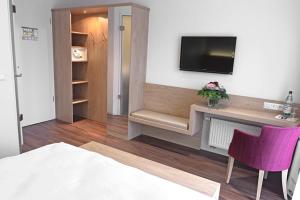 TV a/nebo společenská místnost v ubytování Hotel Wübbel