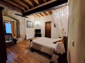 Postel nebo postele na pokoji v ubytování Palacio de los Alvarado en Las Merindades