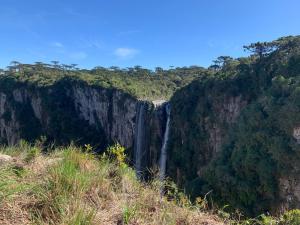 a waterfall on the side of a cliff at Studio dos Canyons in Praia Grande +1 photo