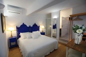 Postel nebo postele na pokoji v ubytování Villa Vanita Agios Ioannis Mykonos