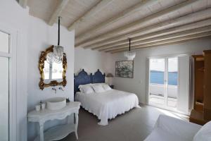 Postel nebo postele na pokoji v ubytování Villa Vanita Agios Ioannis Mykonos