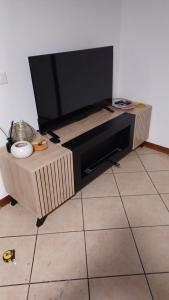 TV a/nebo společenská místnost v ubytování Casa di Minù
