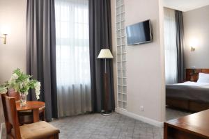 Posteľ alebo postele v izbe v ubytovaní Hotel Piast Wrocław Centrum