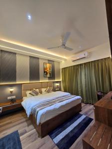 a bedroom with a large bed in a room at Hotel Fortune in Ayodhya