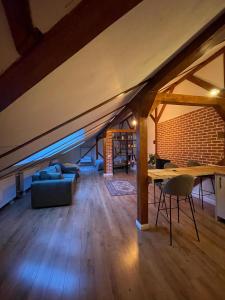 a living room with a couch and a table at Casa Puscariu in Braşov