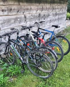 a group of bikes parked next to a wall at Oandu Camping in Oandu