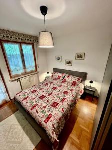 Postel nebo postele na pokoji v ubytování Appartamento sulle piste di Limone