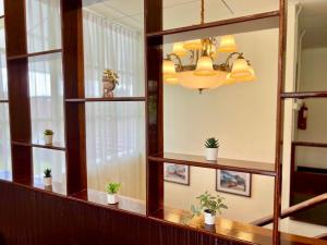a room with shelves with potted plants on them at Zane Balcony House Ranong Hotel เซน บัลโคนี่ เฮ้าส์ ระนอง in Ban Lum Than +177 photos