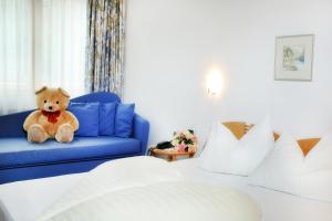 A bed or beds in a room at Hotel Rierhof