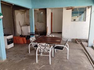 an empty room with a table and chairs in it at Pousada do Paraiba in Salinópolis
