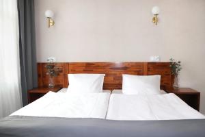 Posteľ alebo postele v izbe v ubytovaní Hotel Piast Wrocław Centrum