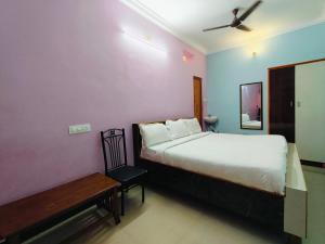 Ένα ή περισσότερα κρεβάτια σε δωμάτιο στο Dhanas Residency Pondicherry