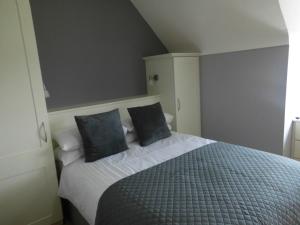 Tempat tidur dalam kamar di Eas Dun Lodge
