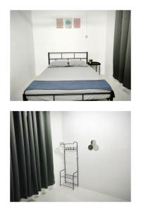 a bedroom with a bed with green curtains at Homestay DprimaSJHome in Temerloh +2 photos