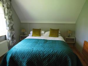 Tempat tidur dalam kamar di Eas Dun Lodge