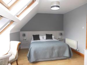 Tempat tidur dalam kamar di Eas Dun Lodge