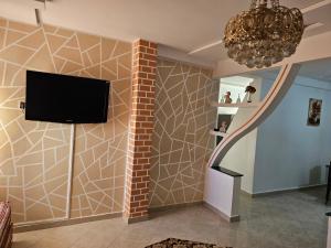 TV a/nebo společenská místnost v ubytování Résidence La Belle d'Orient