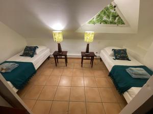 Postelja oz. postelje v sobi nastanitve TI COCOTIER Appartement VUE MER 2 à 6 personnes village Pierre et vacances
