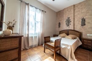 Ein Bett oder Betten in einem Zimmer der Unterkunft Casa el Rincón del Lago Alojamiento Rural