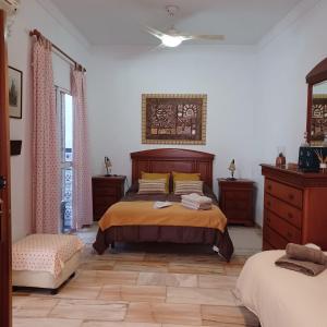 En eller flere senge i et værelse på Casa Con Alma # junto a estación de trenes y muy cerca del centro