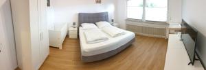 Postel nebo postele na pokoji v ubytování Wohnung 59 + 17 fotografií