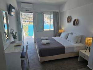 Postel nebo postele na pokoji v ubytování Galazio Rooms & Suites