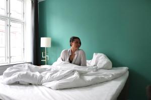 Un pat sau paturi într-o cameră la A Hotels City