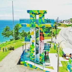 a colorful building on the side of a road at West Side Studio Apartments in Anasco