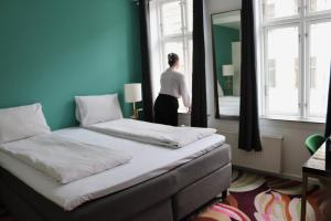 Un pat sau paturi într-o cameră la A Hotels City +84 fotografii