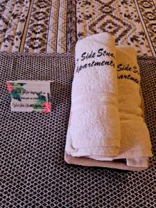 a couple of towels sitting on top of a table at West Side Studio Apartments in Anasco