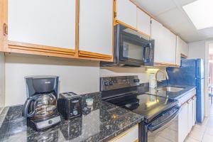 a kitchen with a coffee maker and a blender at Spacious 1 BR Condo- Stunning Oceanfront Views- Landmark 1434 in Myrtle Beach