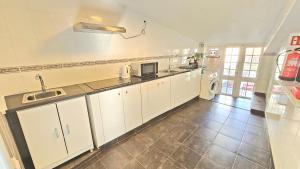 Kuchyň nebo kuchyňský kout v ubytování K&K Apartment