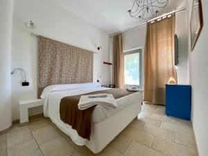 Voodi või voodid majutusasutuse Masseria Trullo Sovrano Exclusive B&B toas
