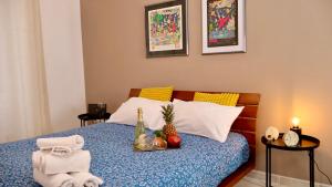 a bedroom with a bed with fruit on it at CinqueTerre Casa Simón La Spezia in La Spezia