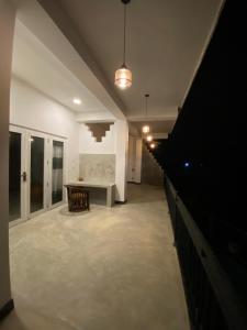 a large room with a table and a bench in it at Southern grace unawatuna in Unawatuna