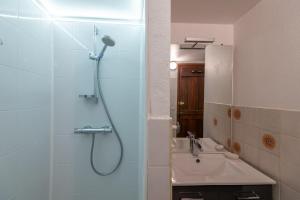 a bathroom with a shower and a sink at Gites de france 2 epis 5 personnes a mazel bouissy in Le Mazel-Bouissy +18 photos