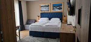 Postel nebo postele na pokoji v ubytování apartmány Špacír