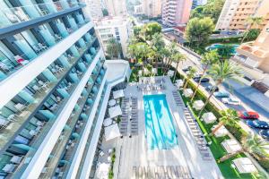 an aerial view of a building with a swimming pool at Port Alicante City & Beach in Alicante