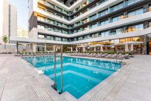 an image of a building with a swimming pool at Port Alicante City & Beach in Alicante