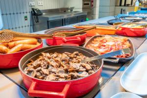 a bunch of dishes of food on a table at Port Alicante City & Beach in Alicante