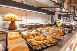 a bakery filled with lots of different types of bread at Port Alicante City & Beach in Alicante