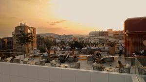 a group of people sitting on the roof of a building at Port Alicante City & Beach in Alicante
