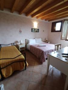 Postel nebo postele na pokoji v ubytování Agriturismo Nuvolino