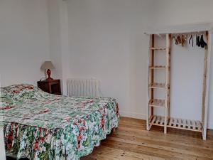 a bedroom with a bed and a book shelf at Villa au cœur de la station - 1540 in Soulac-sur-Mer
