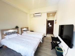 Postel nebo postele na pokoji v ubytování 散步的喵 + 14 fotografií