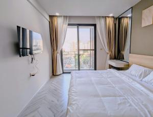 Ένα ή περισσότερα κρεβάτια σε δωμάτιο στο Real Homes